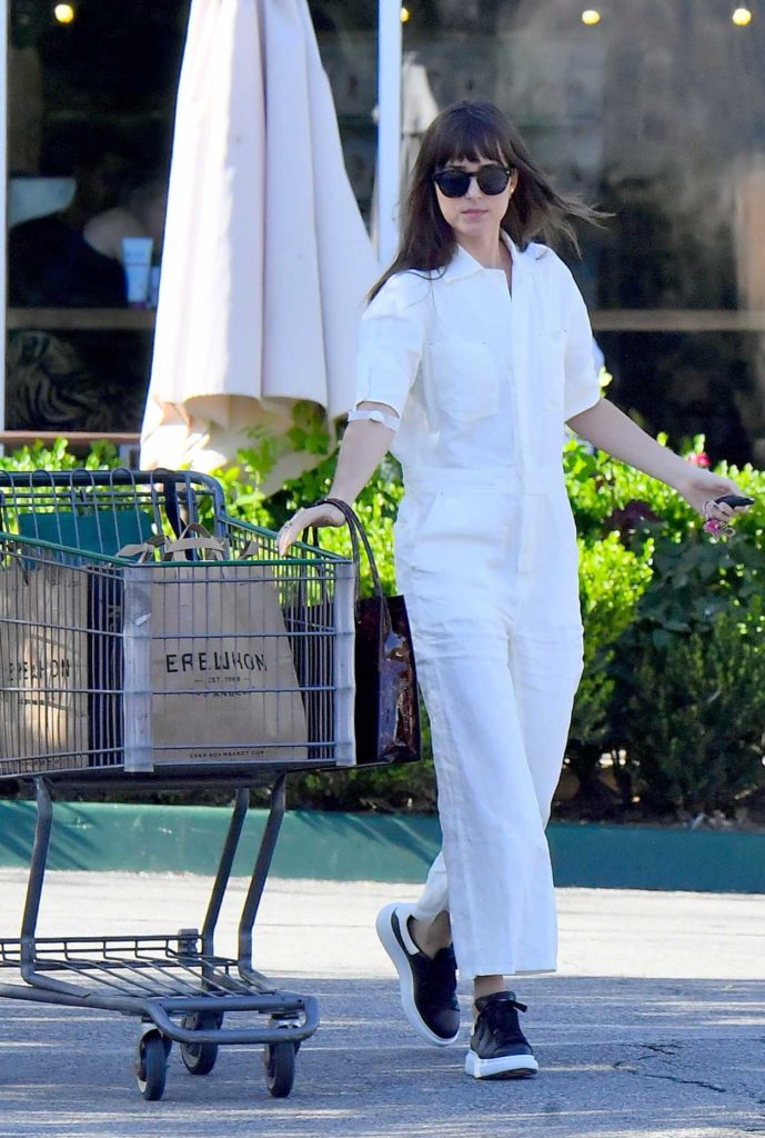 Dakota Johnson in a White Jumpsuit