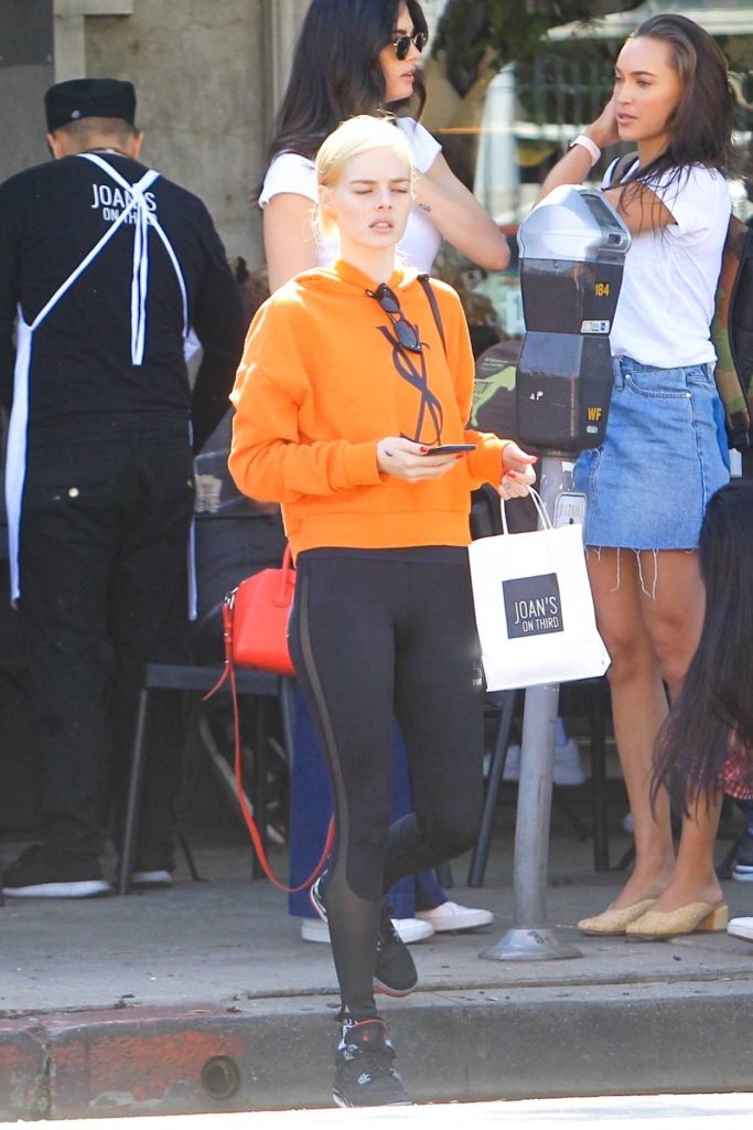 Samara Weaving in an Orange Hoody