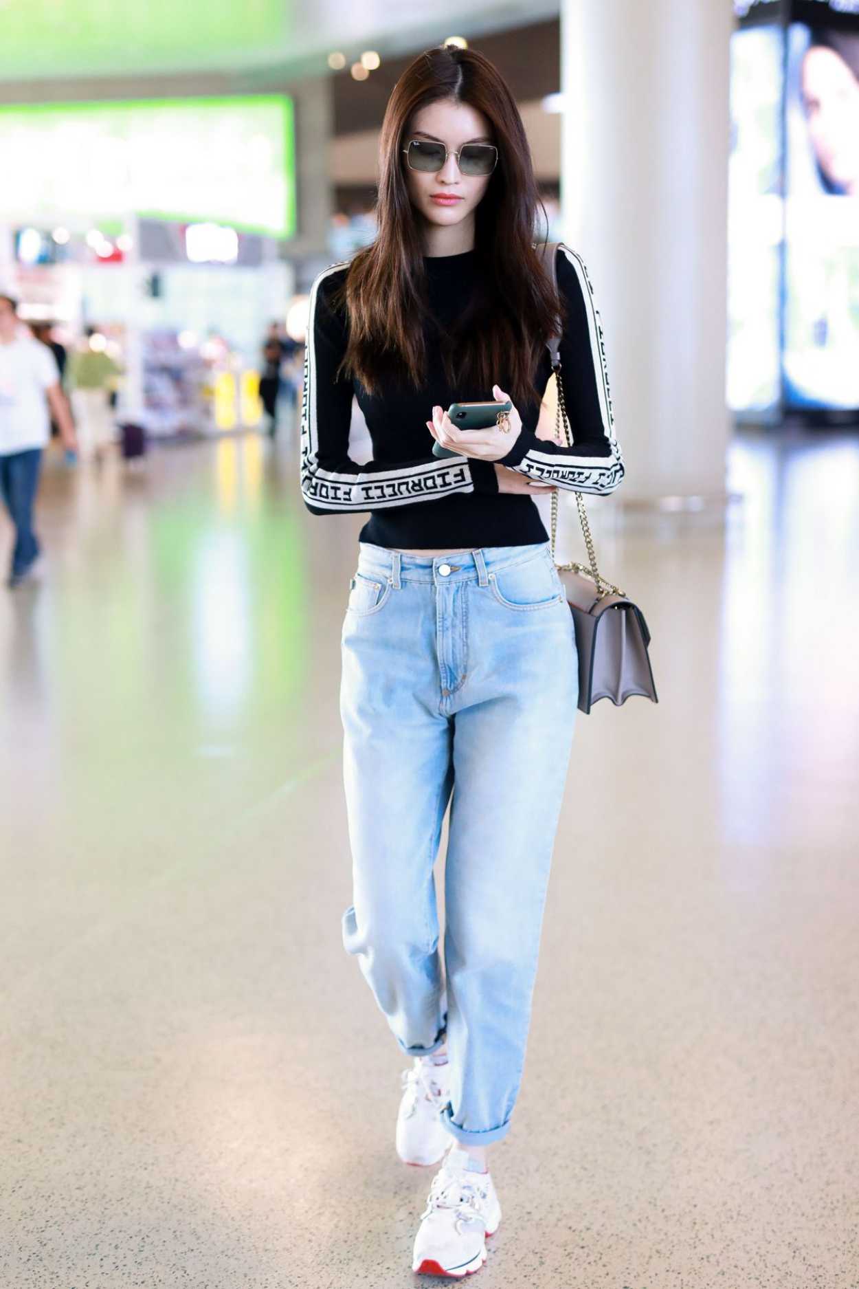 Sui He in a Blue Jeans Arrives at Shanghai Hongqiao Airport in Shanghai ...
