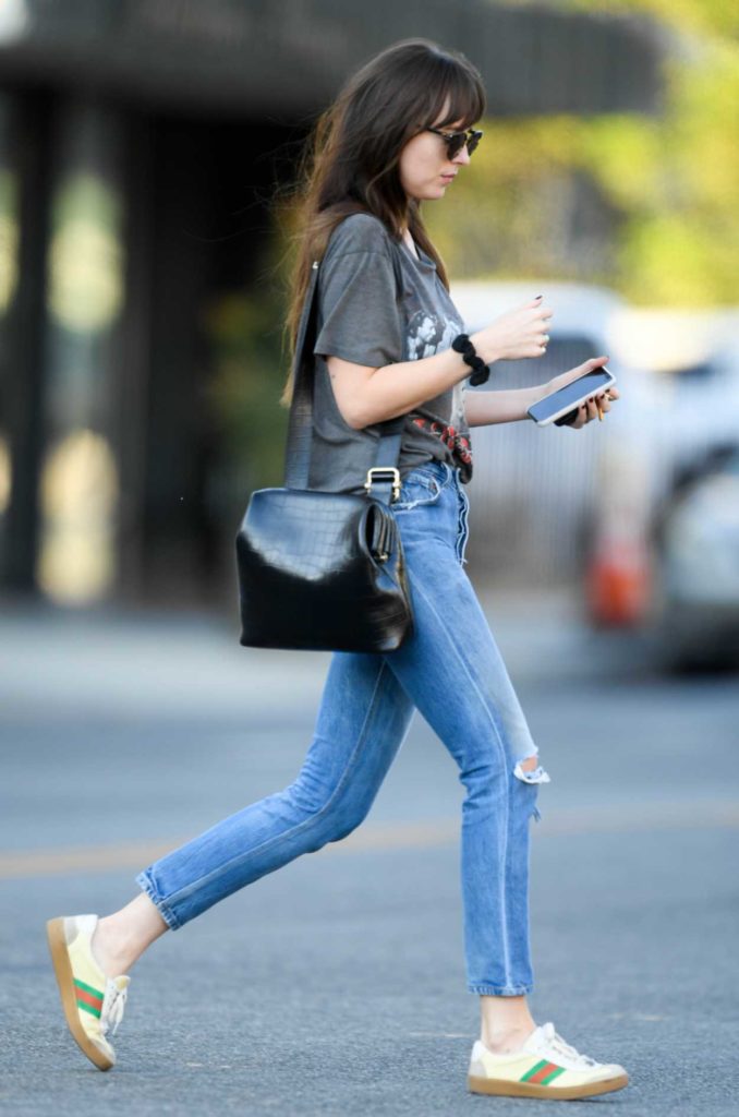 Dakota Johnson in a Blue Ripped Jeans
