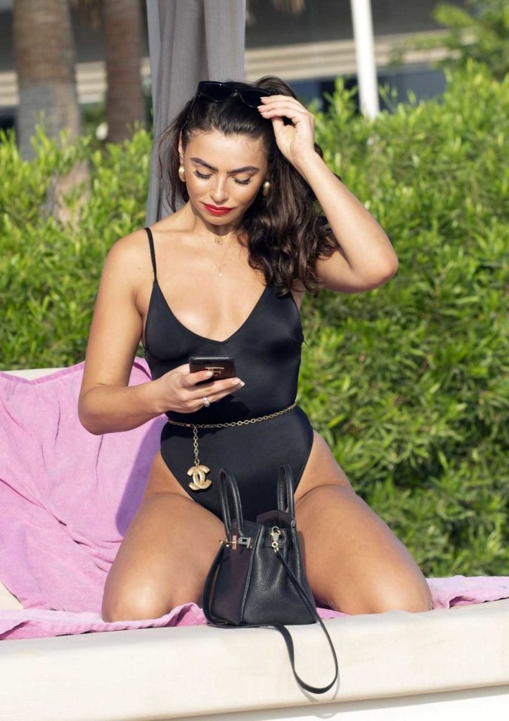 Francesca Allen in a Black Swimsuit