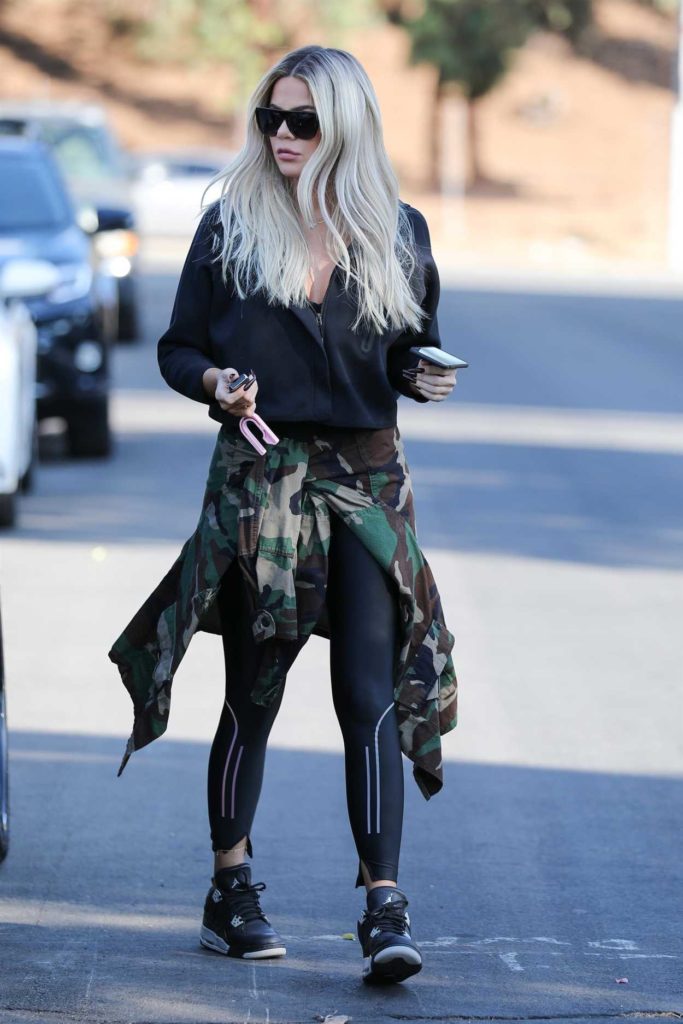 Khloe Kardashian in a Black Sneakers