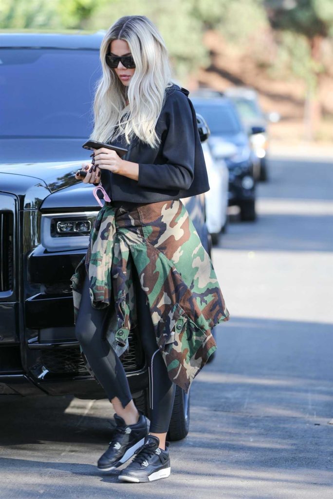 Khloe Kardashian in a Black Sneakers