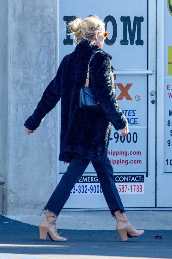 Emma Roberts in a Black Fur Coat