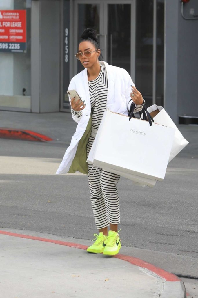 Kelly Rowland in a Neon Green Sneakers