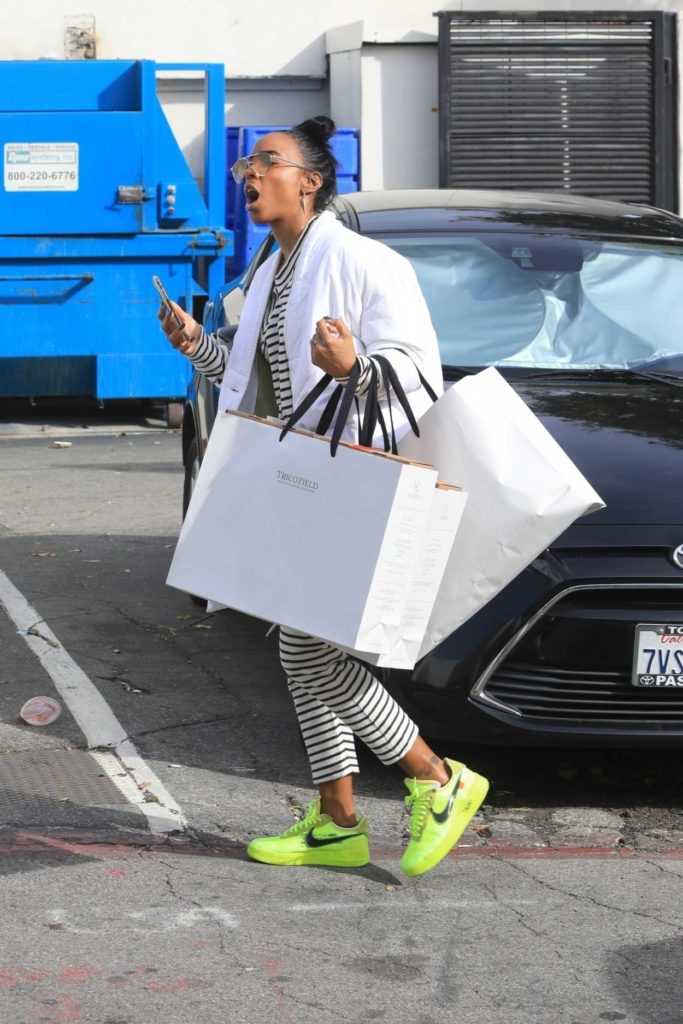 Kelly Rowland in a Neon Green Sneakers