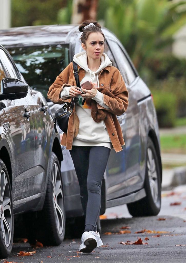 Lily Collins in a White Sneakers