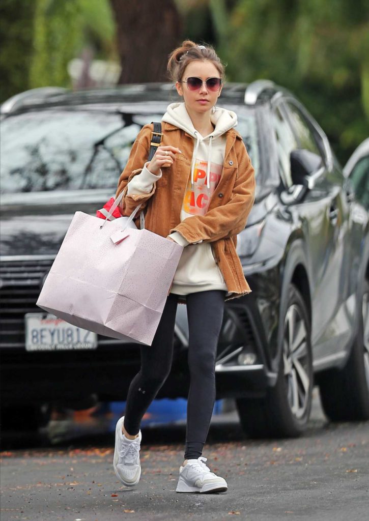 Lily Collins in a White Sneakers