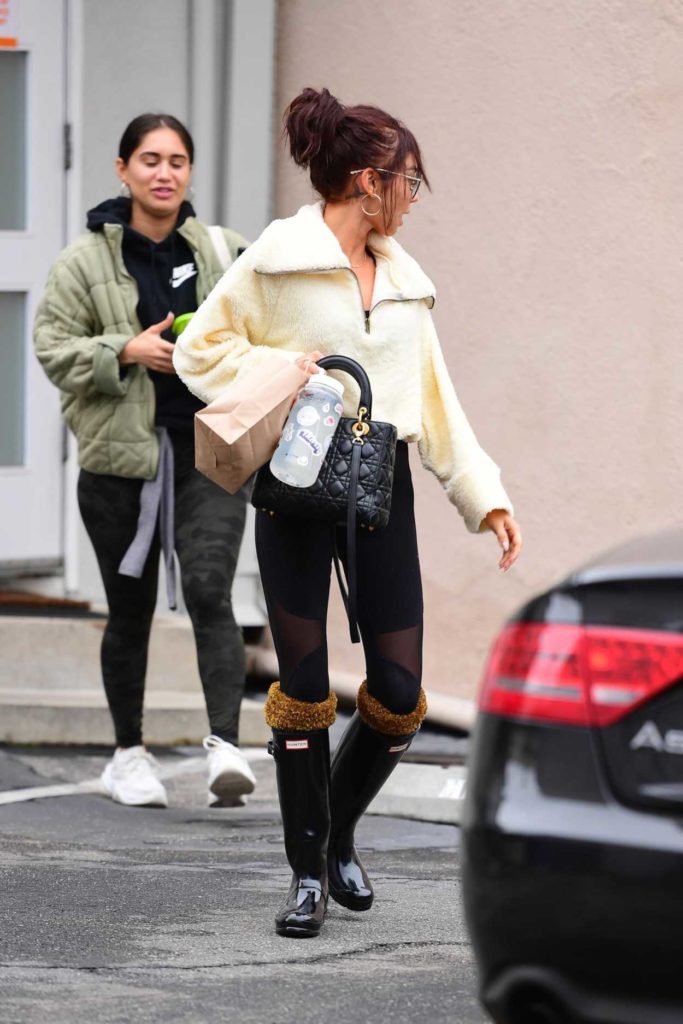 Sarah Hyland in a Black Rubber Boots