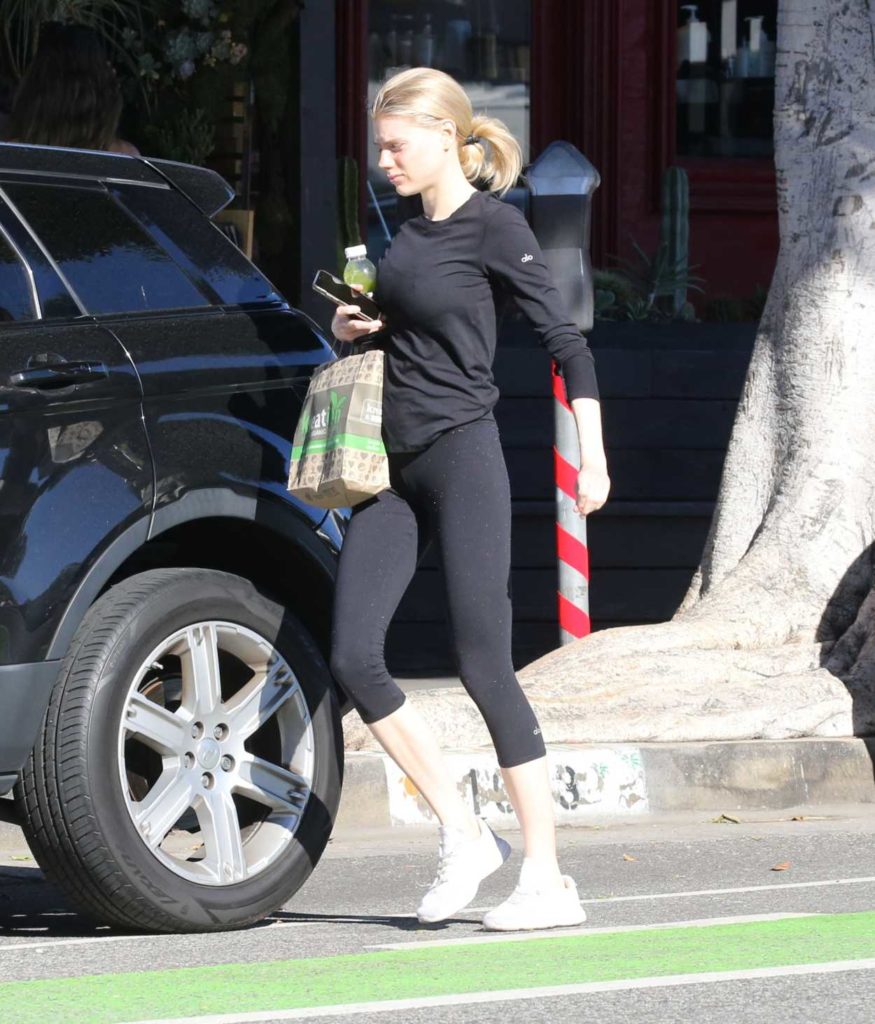 Charlotte McKinney in a White Sneakers