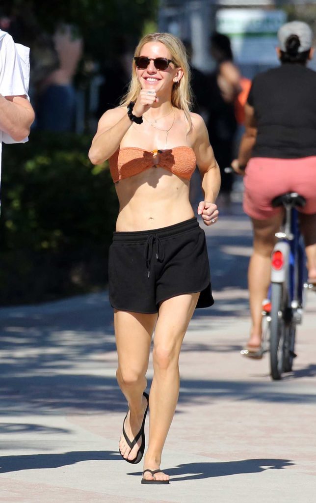 Ellie Goulding in an Orange Bikini Top