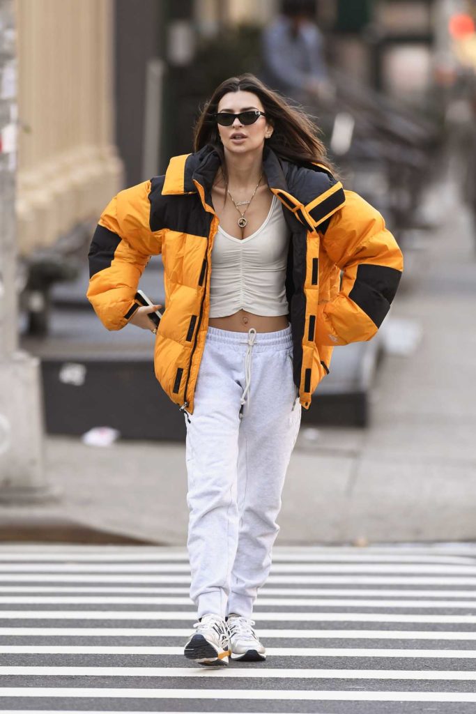 Emily Ratajkowski in an Orange Puffer Jacket