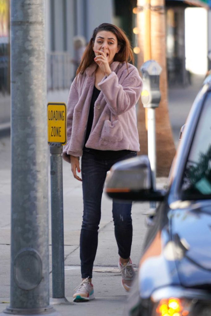 Mila Kunis in a Purple Jacket