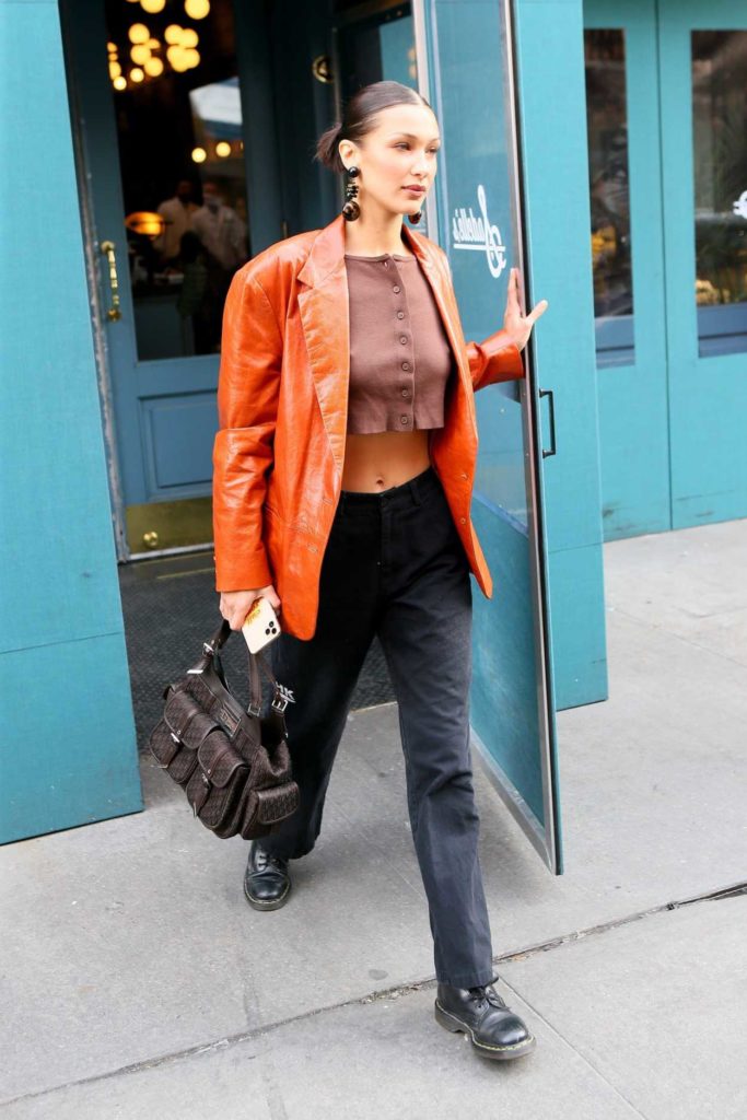 Bella Hadid in an Orange Leather Blazer