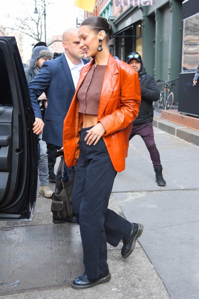 Bella Hadid in an Orange Leather Blazer