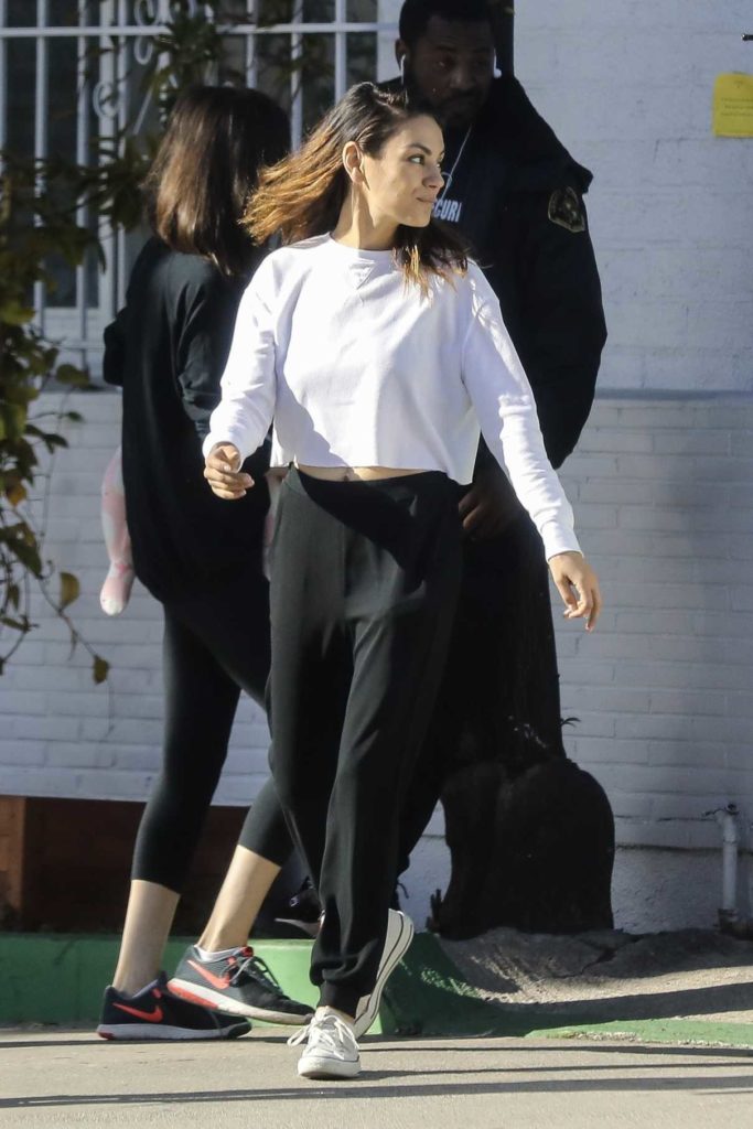 Mila Kunis in a Black Sweatpants