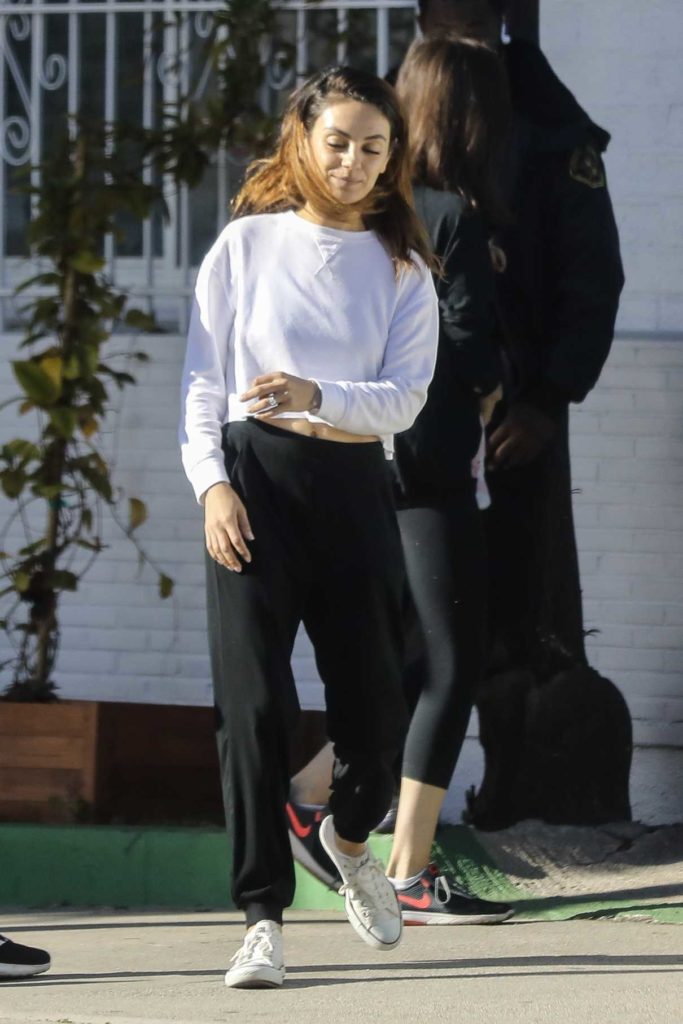 Mila Kunis in a Black Sweatpants