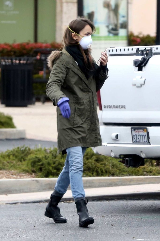 Lily Collins in a Purple Medical Gloves Leaves