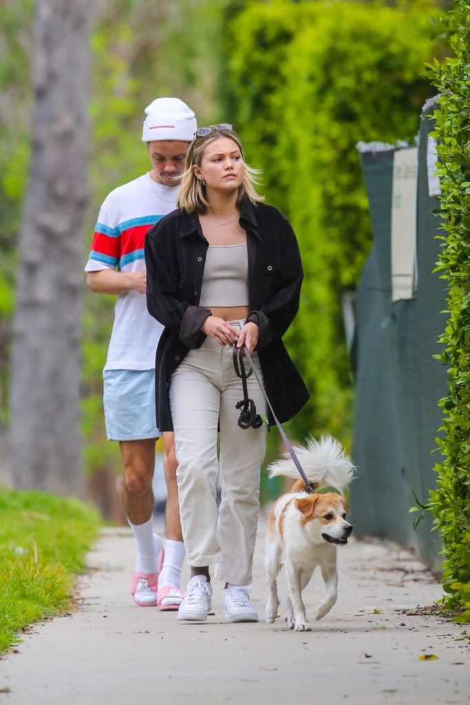 Olivia Holt in a White Sneakers