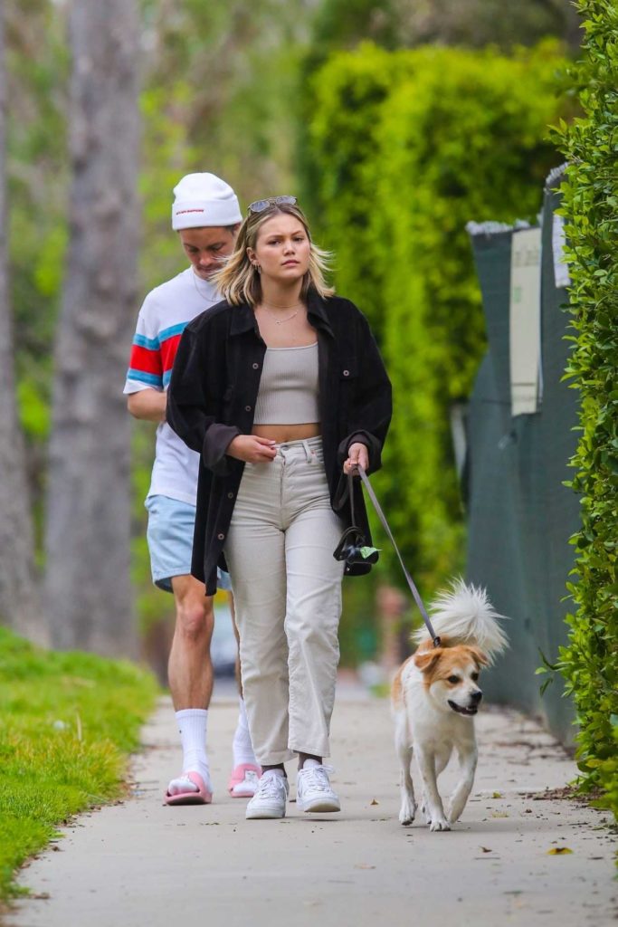 Olivia Holt in a White Sneakers