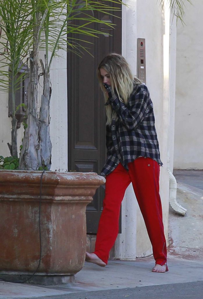 Ashley Benson in a Red Track Pants