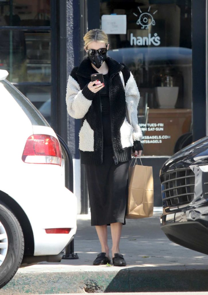 Emma Roberts in a Black Protective Mask