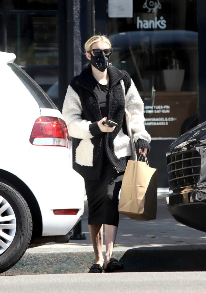 Emma Roberts in a Black Protective Mask
