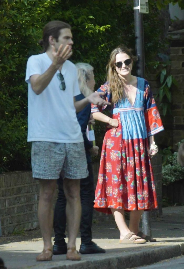 Keira Knightley in a Red Floral Dress