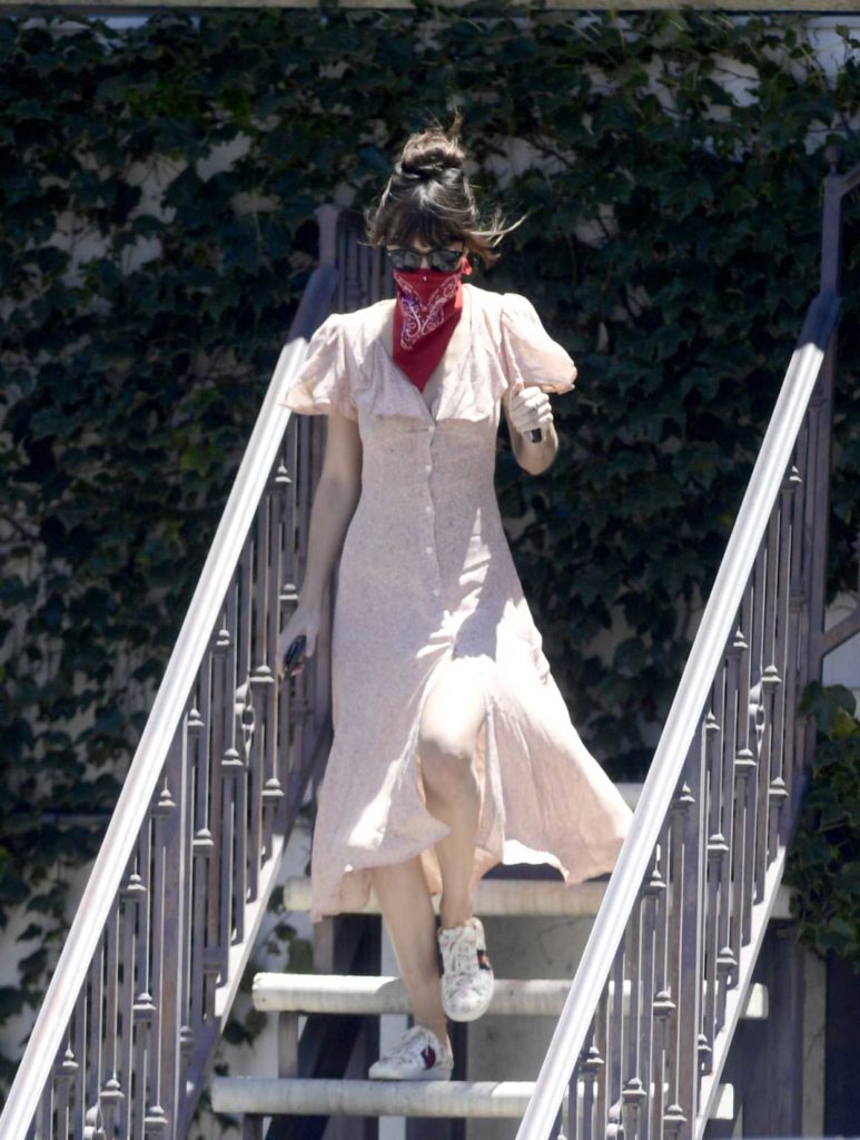 Dakota Johnson in a Red Bandana as a Face Mask