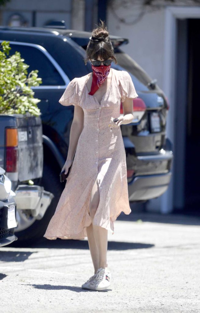 Dakota Johnson in a Red Bandana as a Face Mask