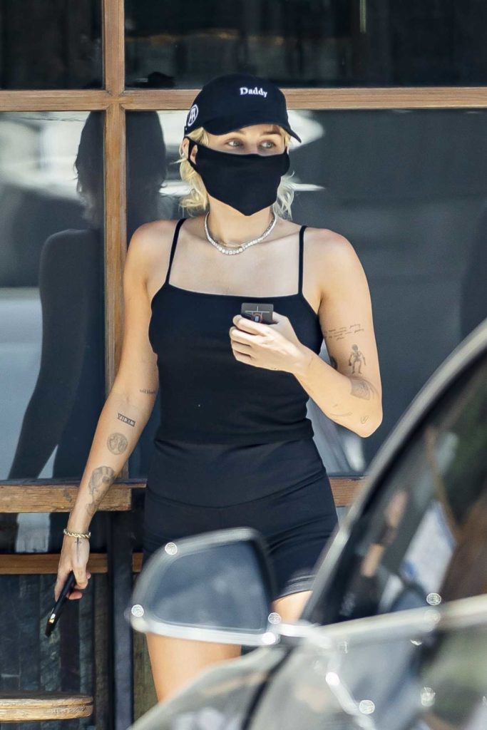 Miley Cyrus in a Black Cap