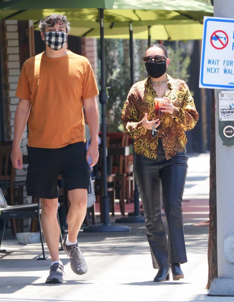 Charli XCX in a Black Protective Mask