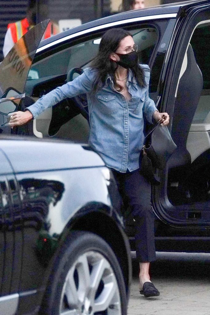 Courteney Cox in a Black Protective Mask