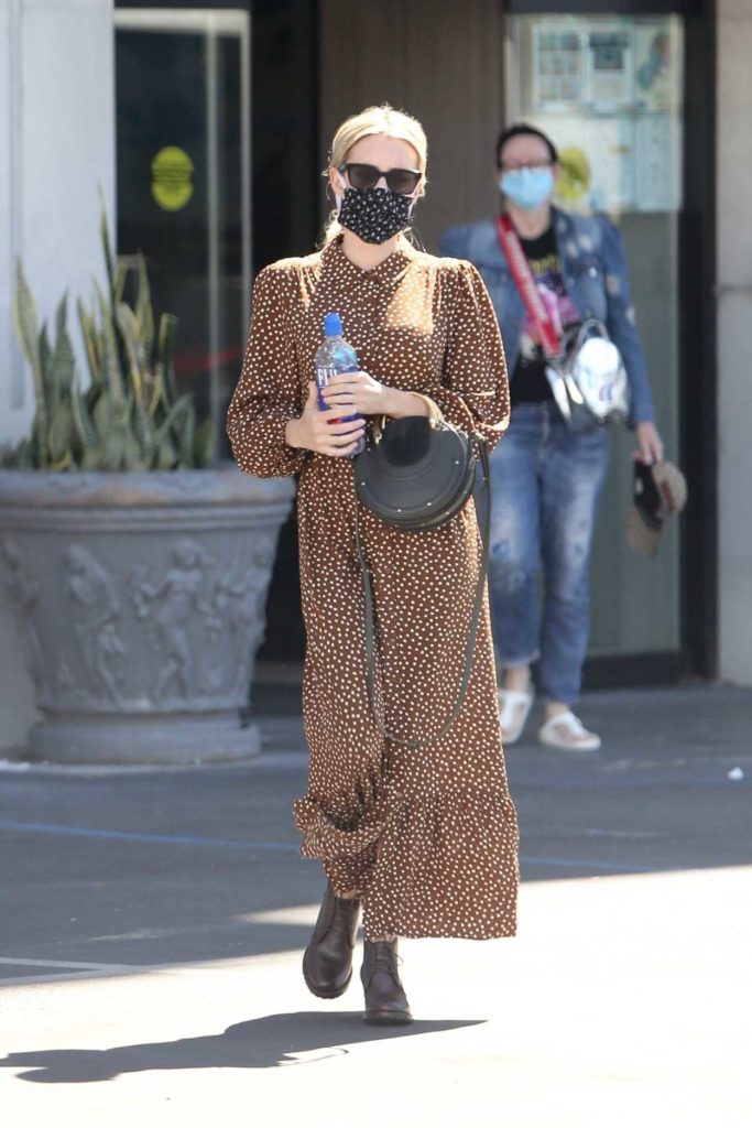 Emma Roberts in a Protective Mask