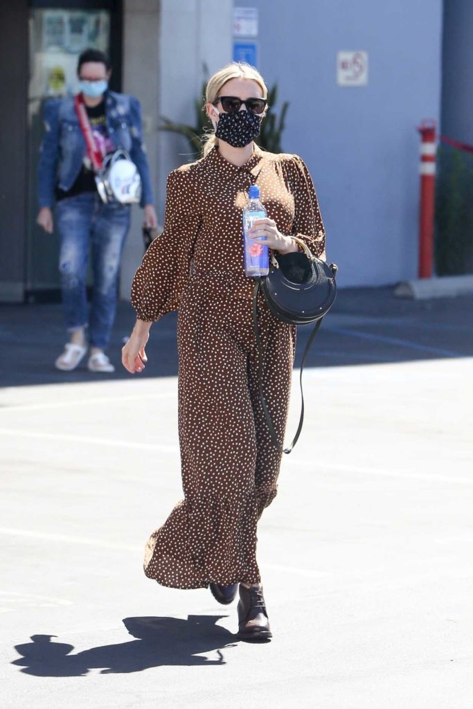 Emma Roberts in a Protective Mask