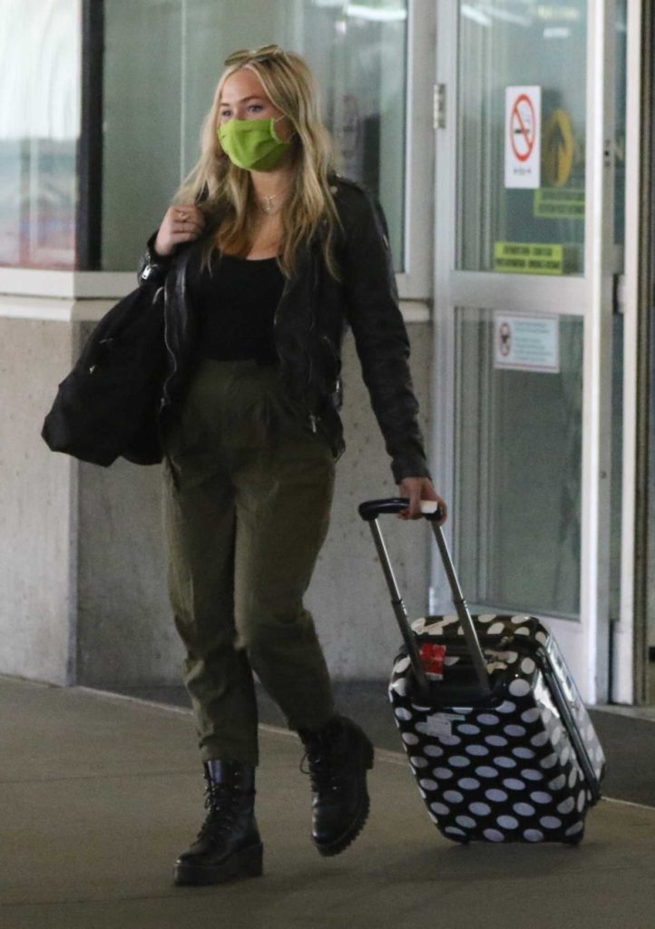 Natalie Alyn Lind in a Green Protective Mask