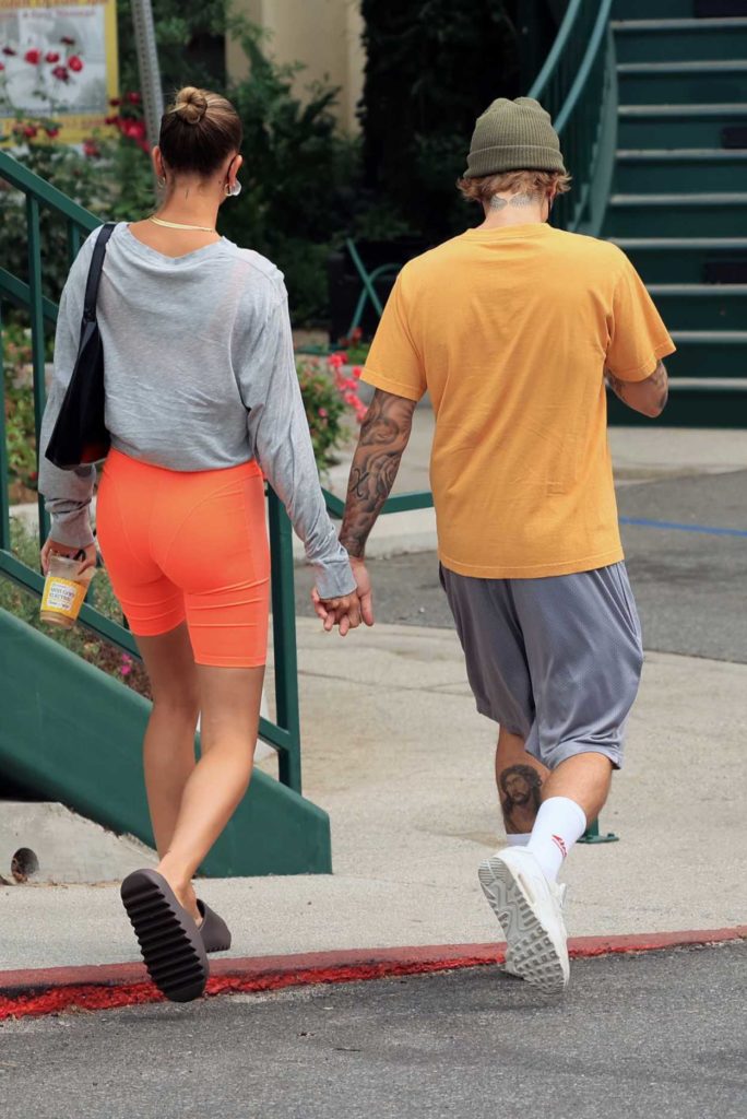 Hailey Bieber in an Orange Spandex Shorts