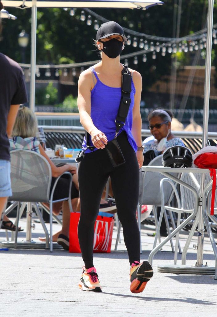 Kaley Cuoco in a Purple Tank Top Walks Through Battery Park in Downtown