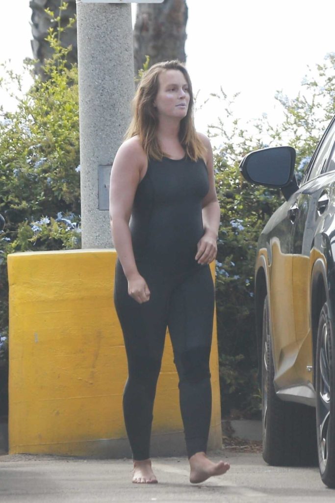 Leighton Meester in a Black Surfing Outfit