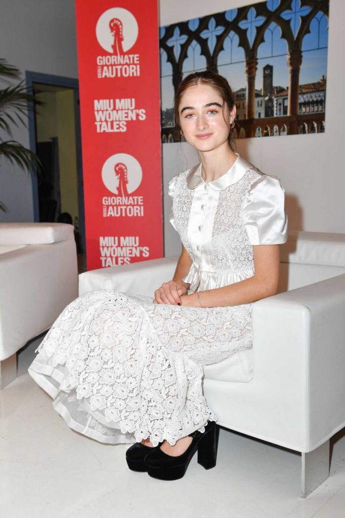 Raffey Cassidy in a White Floral Suit