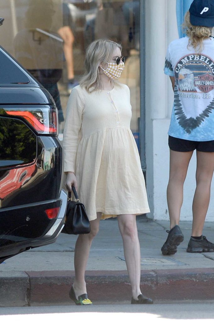 Emma Roberts in a Beige Dress