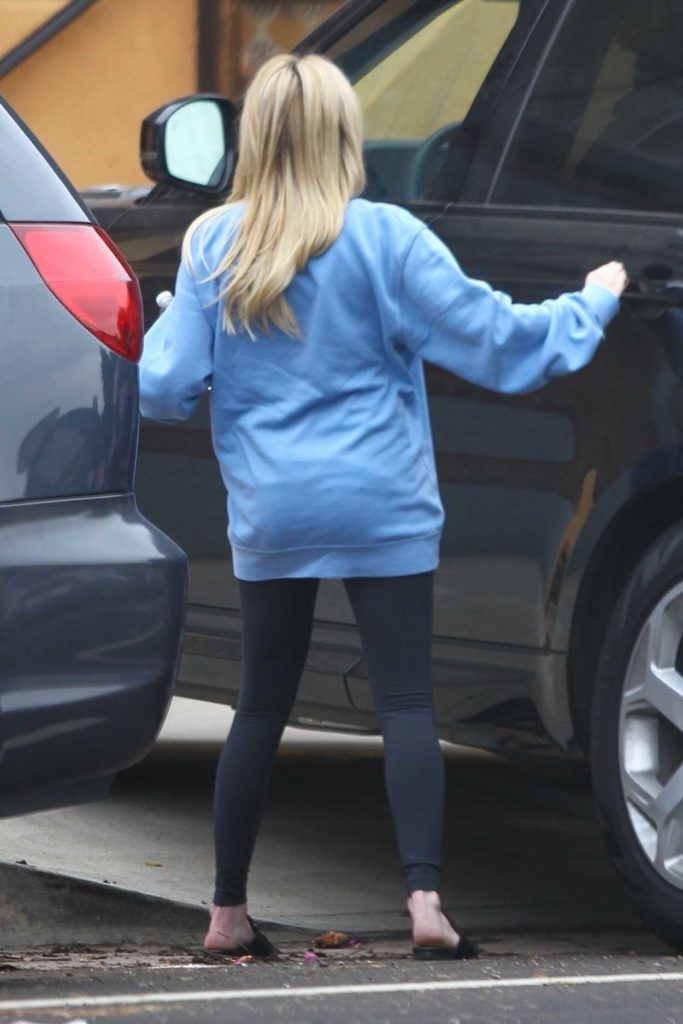 Emma Roberts in a Light Blue Sweatshirt