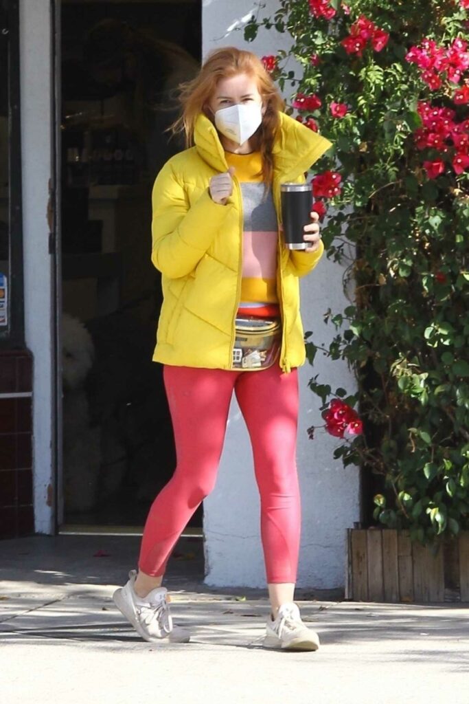 Isla Fisher in a Yellow Puffer Jacket