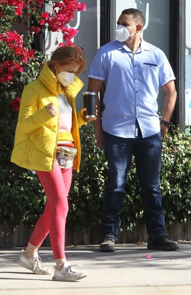 Isla Fisher in a Yellow Puffer Jacket