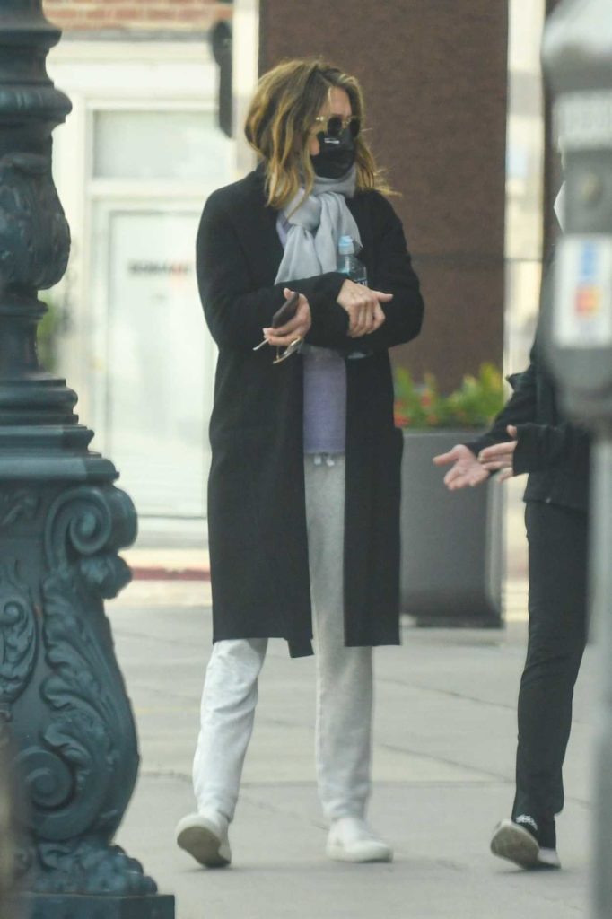 Jennifer Aniston in a Black Coat