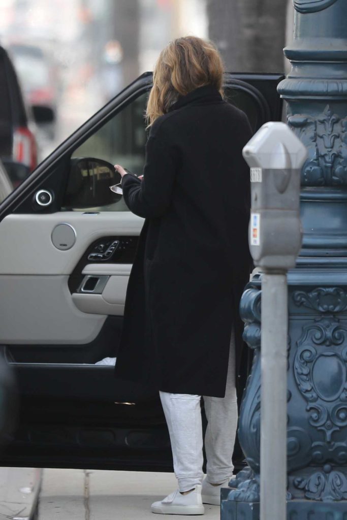 Jennifer Aniston in a Black Coat