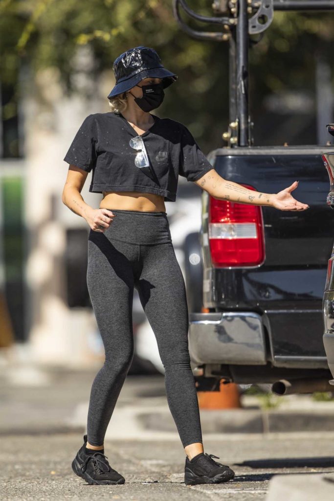 Miley Cyrus in a Black Protective Mask