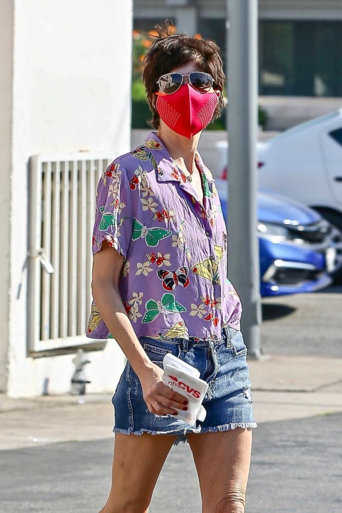 Selma Blair in a Red Protective Mask