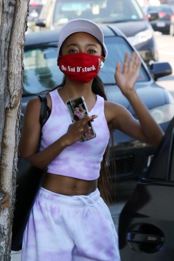Skai Jackson in a Red Protective Mask
