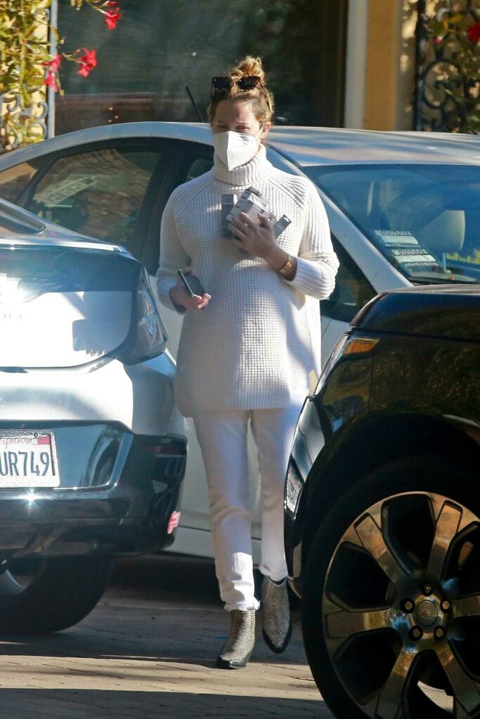 Ashley Tisdale in a White Knit Turtleneck